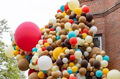 Balloons covering a building